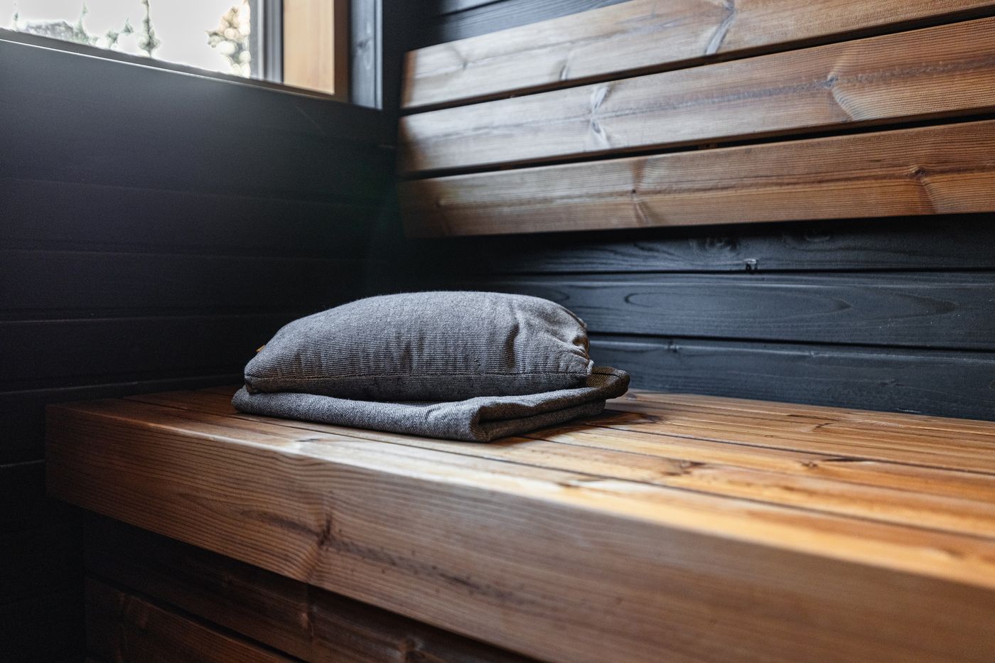 Sauna bench with a cushion and a window