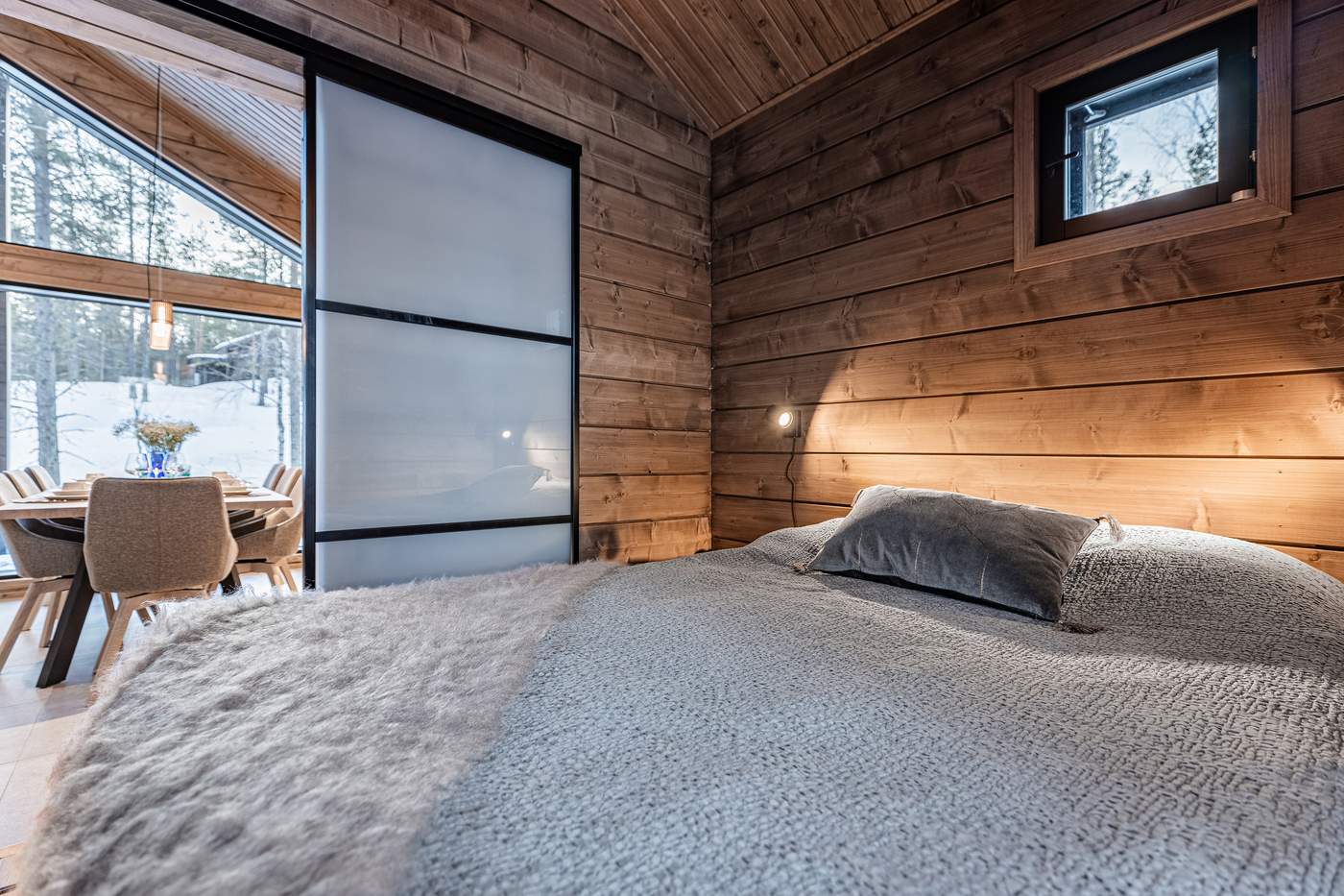 Bedroom with sliding partition and a view of the dining table