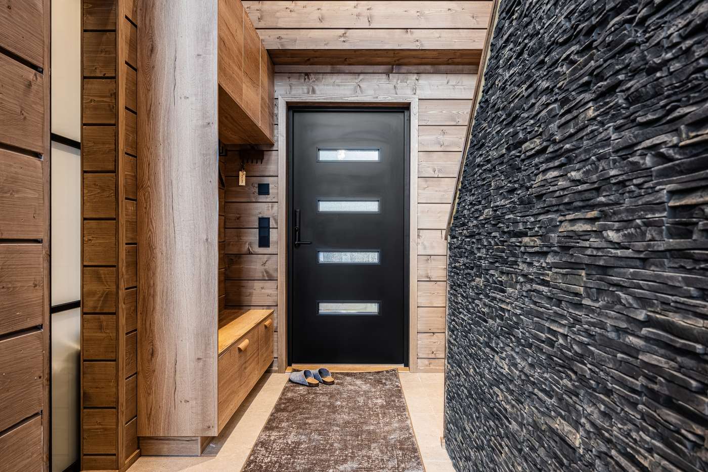 Hallway with wardrobe and black front door