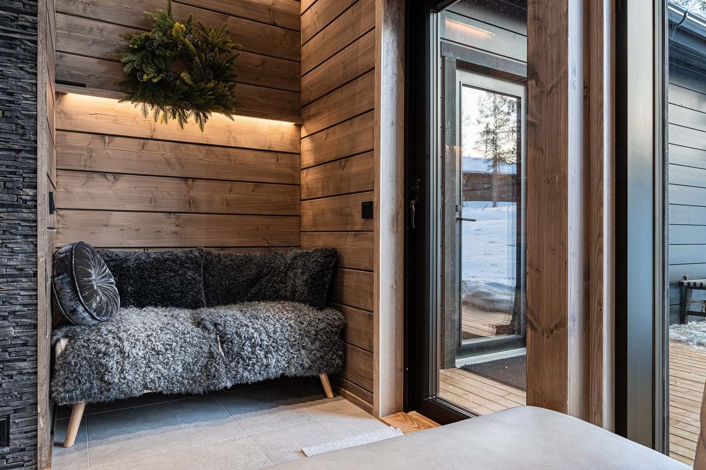 Cosy seating nook with sheepskin by the terrace door